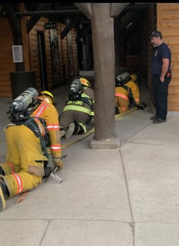 Bras for the Cause: Firefighters suit up in special gear for a