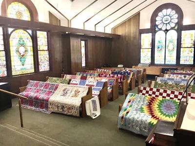 Church congregants craft quilts