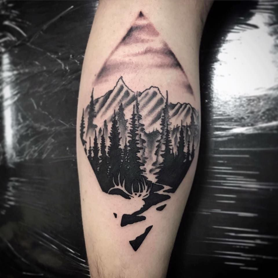 Young wilderness traveler woman with mountains in dreamy tattoo style.