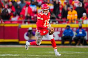 Dec 14, 2025; Kansas City, Missouri, USA; Kansas City Chiefs quarterback Patrick Mahomes (15) runs the ball during the second half against the Los Angeles Chargers at GEHA Field at Arrowhead Stadium. Mandatory Credit: Jay Biggerstaff-Imagn Images
