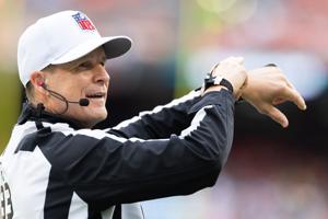 NFL referee Shawn Hochuli acknowledges the crowd during the third quarter of the game between the Cleveland Browns and the Miami Dolphins in October at Huntington Bank Field in Cleveland.