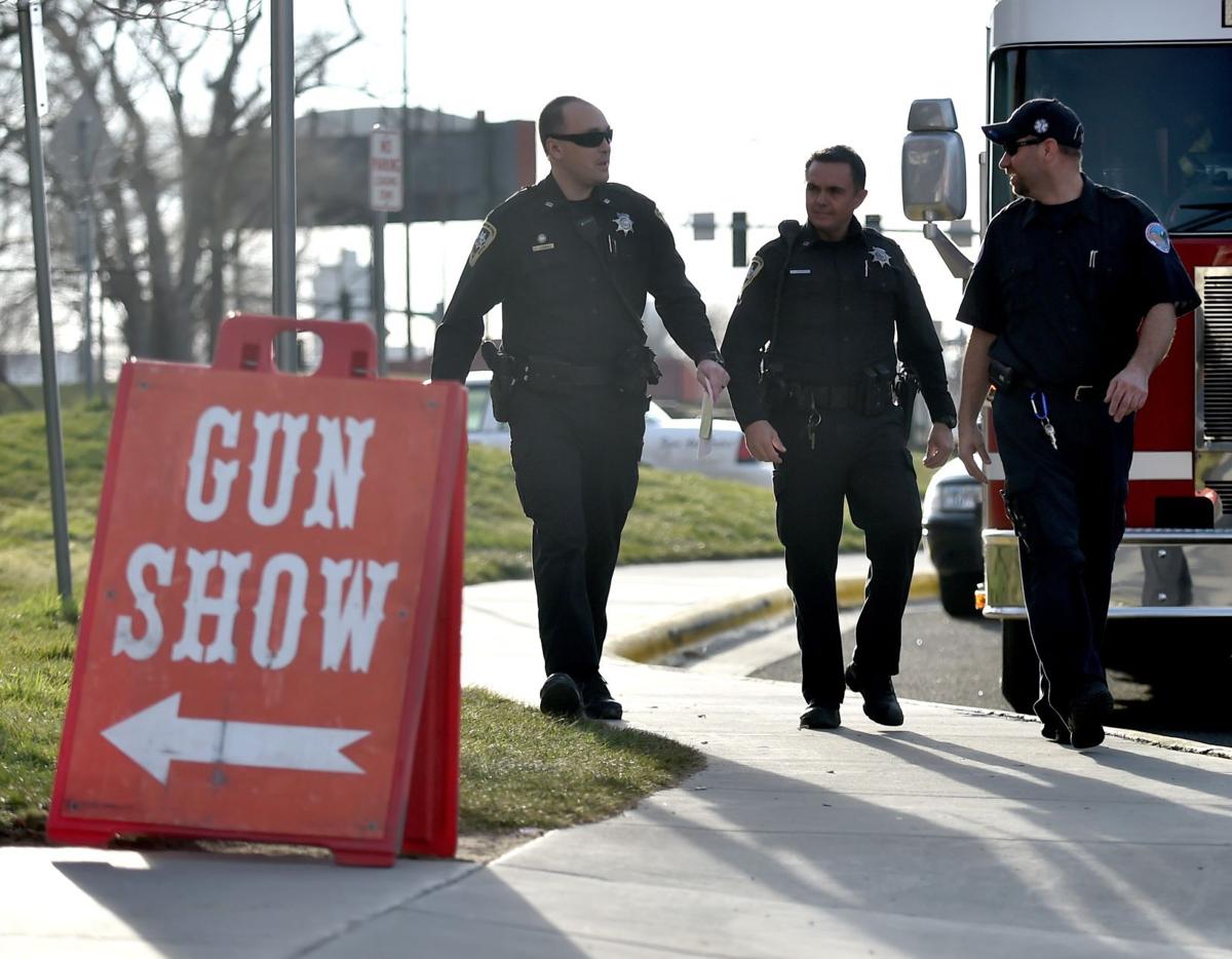 Vendor's gun fires at gun show, hits man in hand; girl hit by shrapnel