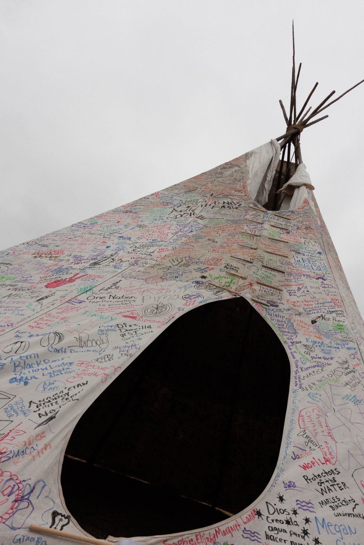 Signatures mark a tepee