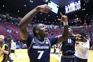 Mar 20, 2026; San Diego, CA, USA; Utah State Aggies guard Kolby King (7) reacts after defeating the Villanova Wildcats in a first round game of the men's 2026 NCAA Tournament at Viejas Arena. Mandatory Credit: Denis Poroy-Imagn Images