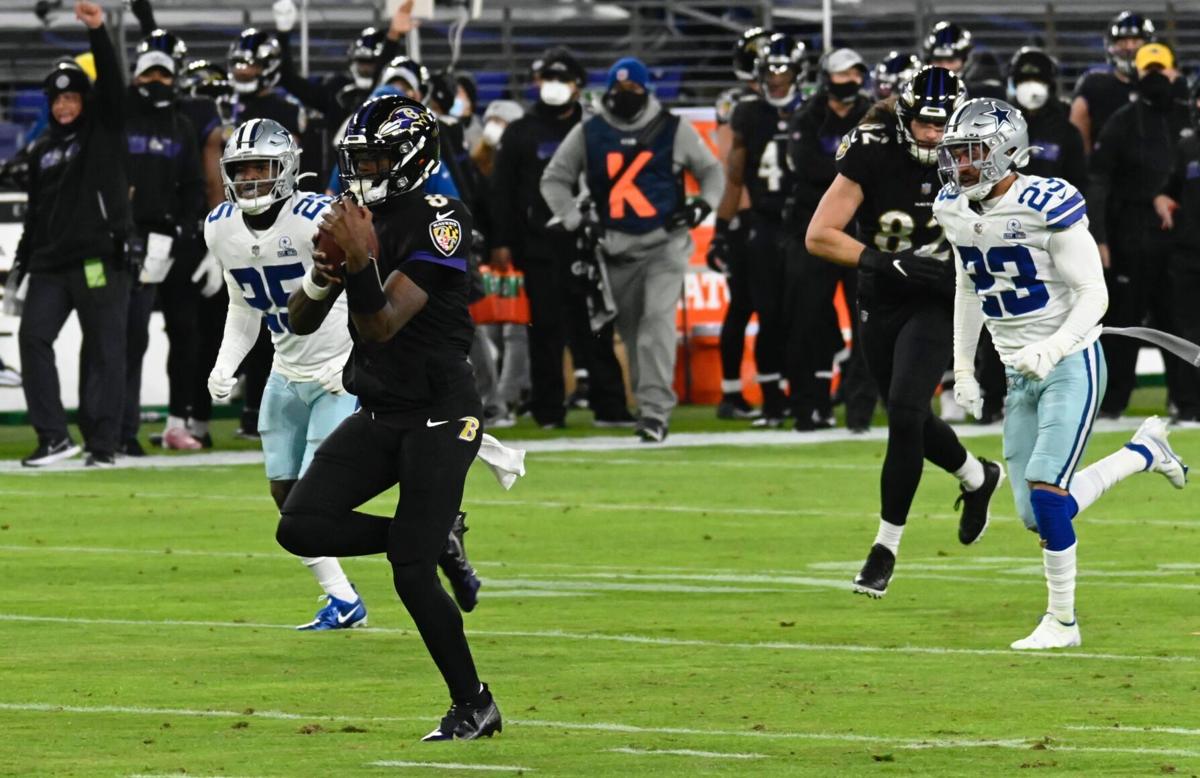 Cowboys' #25, Xavier Woods, and #23, Darian Thompson, try to catch him while Ravens' #82, Luke Willson, defend the play.