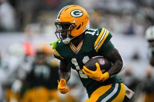 Green Bay Packers wide receiver Jayden Reed (11) runs with the ball during a game against the New York Jets at MetLife Stadium,
