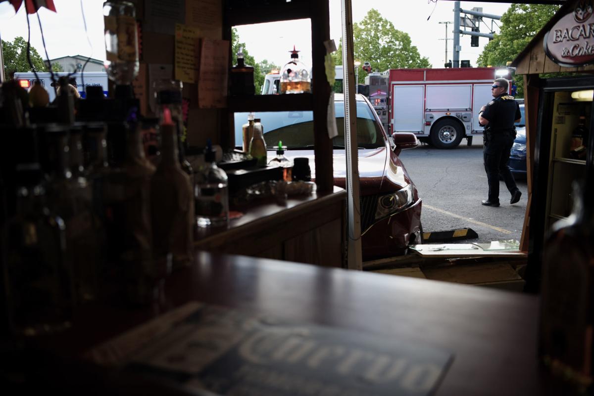 Woman crashes car into Heights liquor store Local News