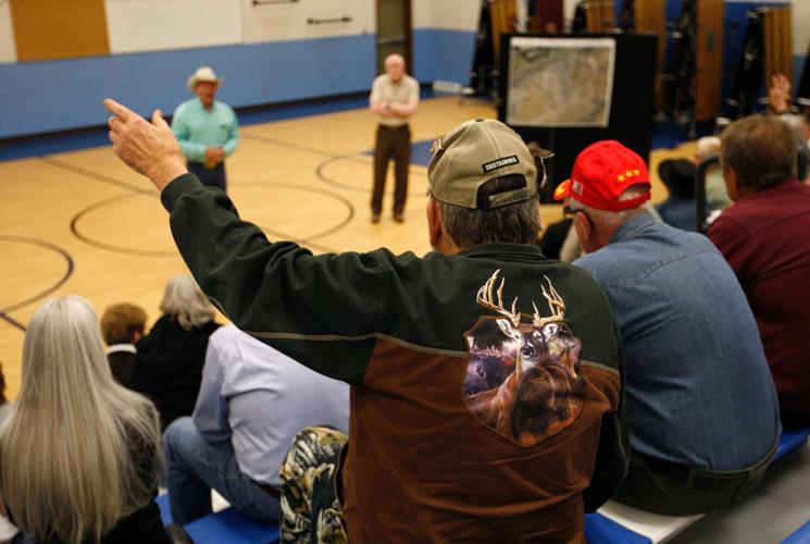 Landfill neighbors hear plans to keep the lid on blowing trash