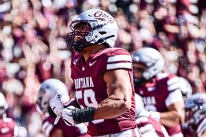 Solomon Tuliaupupu of the Montana Grizzlies reacts after strip sacking defensive back Xavian Andrews of the Indiana State Sycamores during the second quarter on Sept. 20, 2025 in Missoula, Montana.