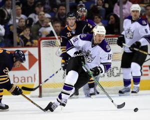 Dec 19, 2008; Buffalo, NY, USA; Los Angeles Kings left wing Kyle Calder (19) skates away from Buffalo Sabres center Adam Mair (22) in the third period at the HSBC Arena. Sabres beat the Kings 5-0. Mandatory Credit: Kevin Hoffman-USA TODAY Sports