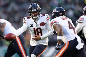 Nov 28, 2025; Philadelphia, Pennsylvania, USA; Chicago Bears quarterback Caleb Williams (18) hands off the ball to Chicago Bears running back D'Andre Swift (4) against the Philadelphia Eagles during the second quarter of the game at Lincoln Financial