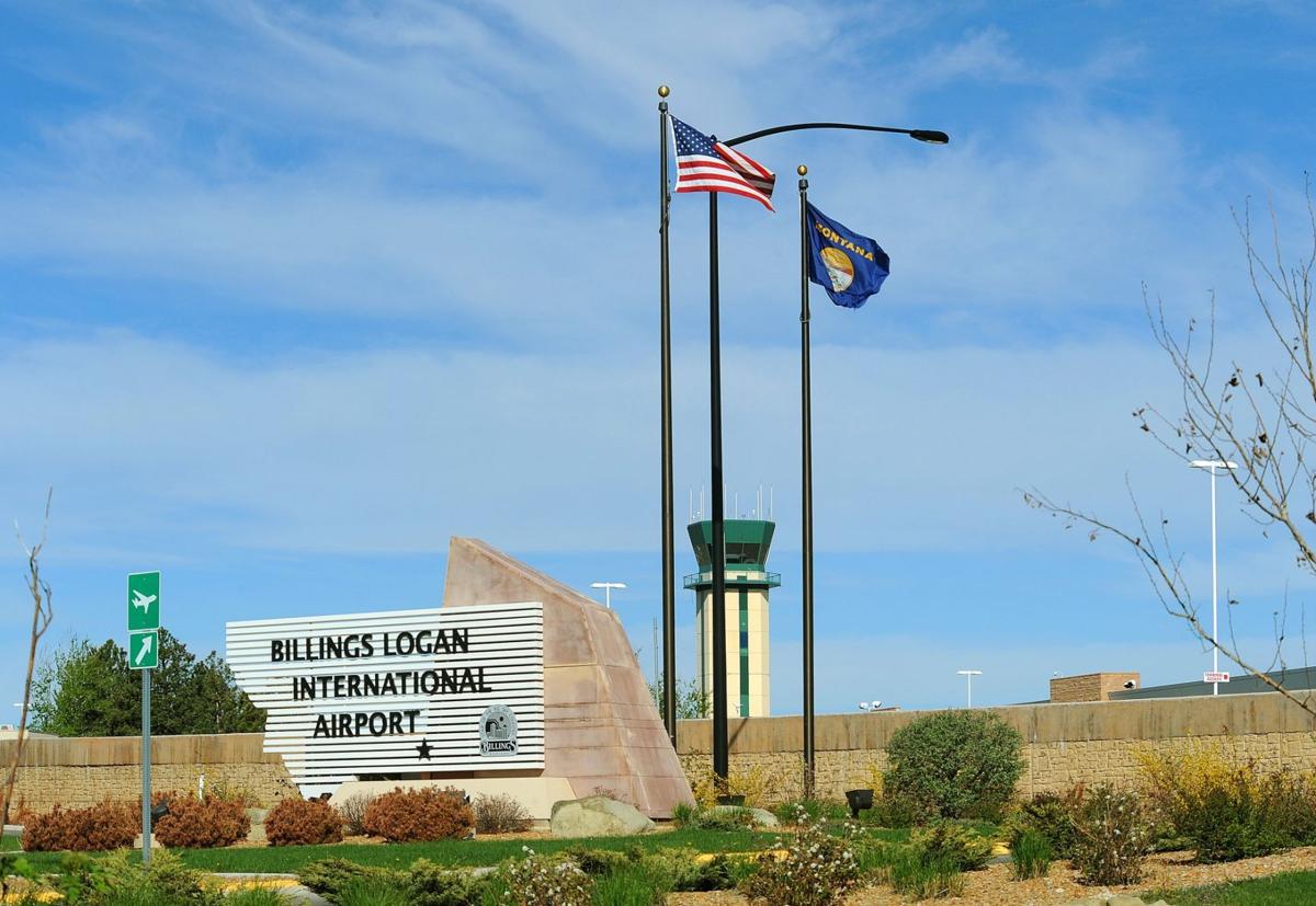 Billings airport entrance sign and flags