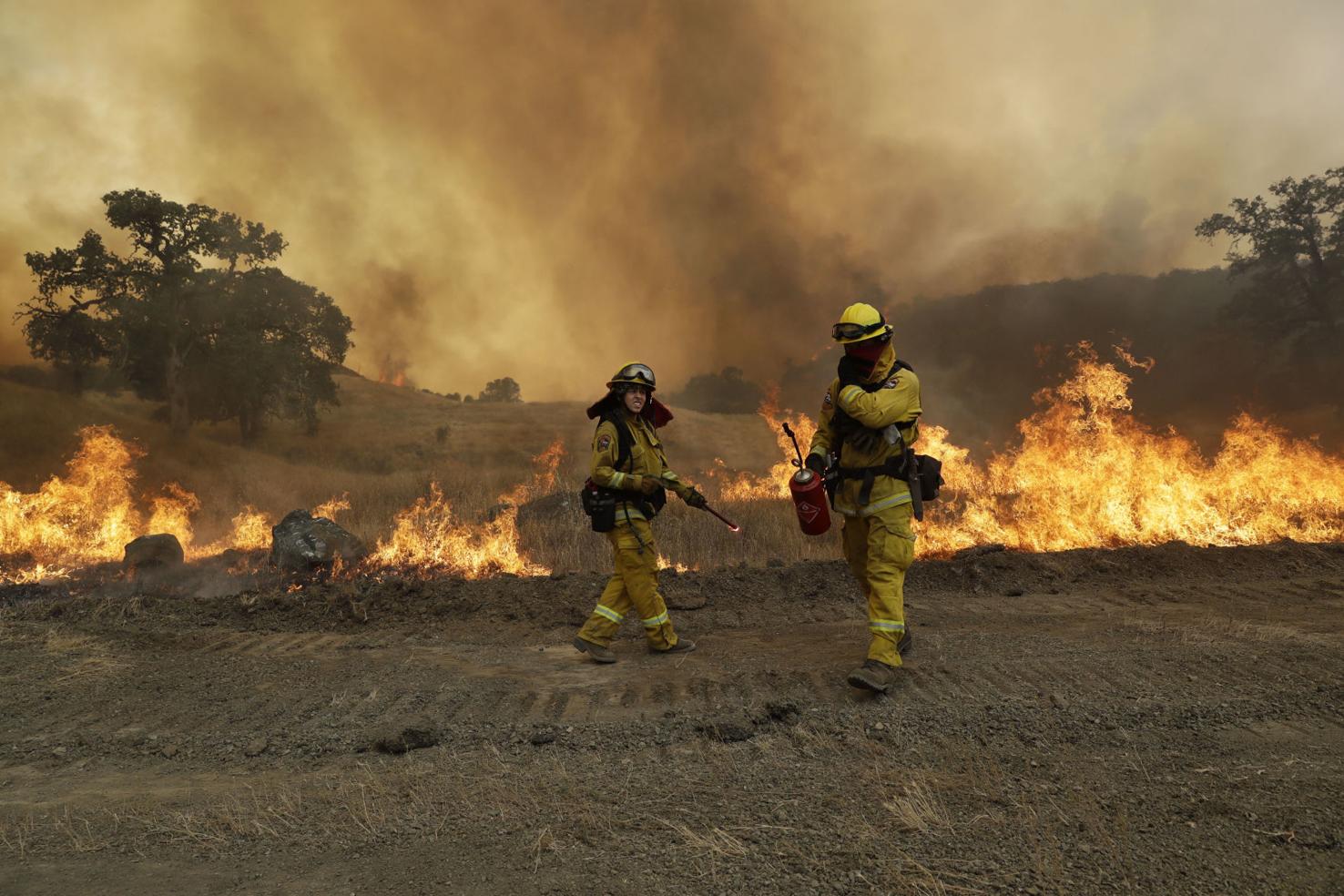 Photos: 10,000 homes at risk of twin California wildfires | National ...
