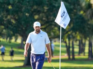 May 1, 2026; Miami, Florida, USA; Scottie Scheffler studies his putt on the 17th hole during the second round of the Cadillac Championship golf tournament. Mandatory Credit: Jeff Romance-Imagn Images
