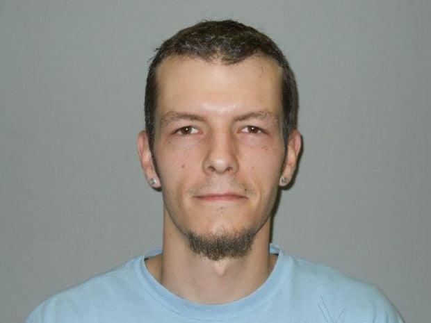 Man charged with robbing convenience store at gunpoint