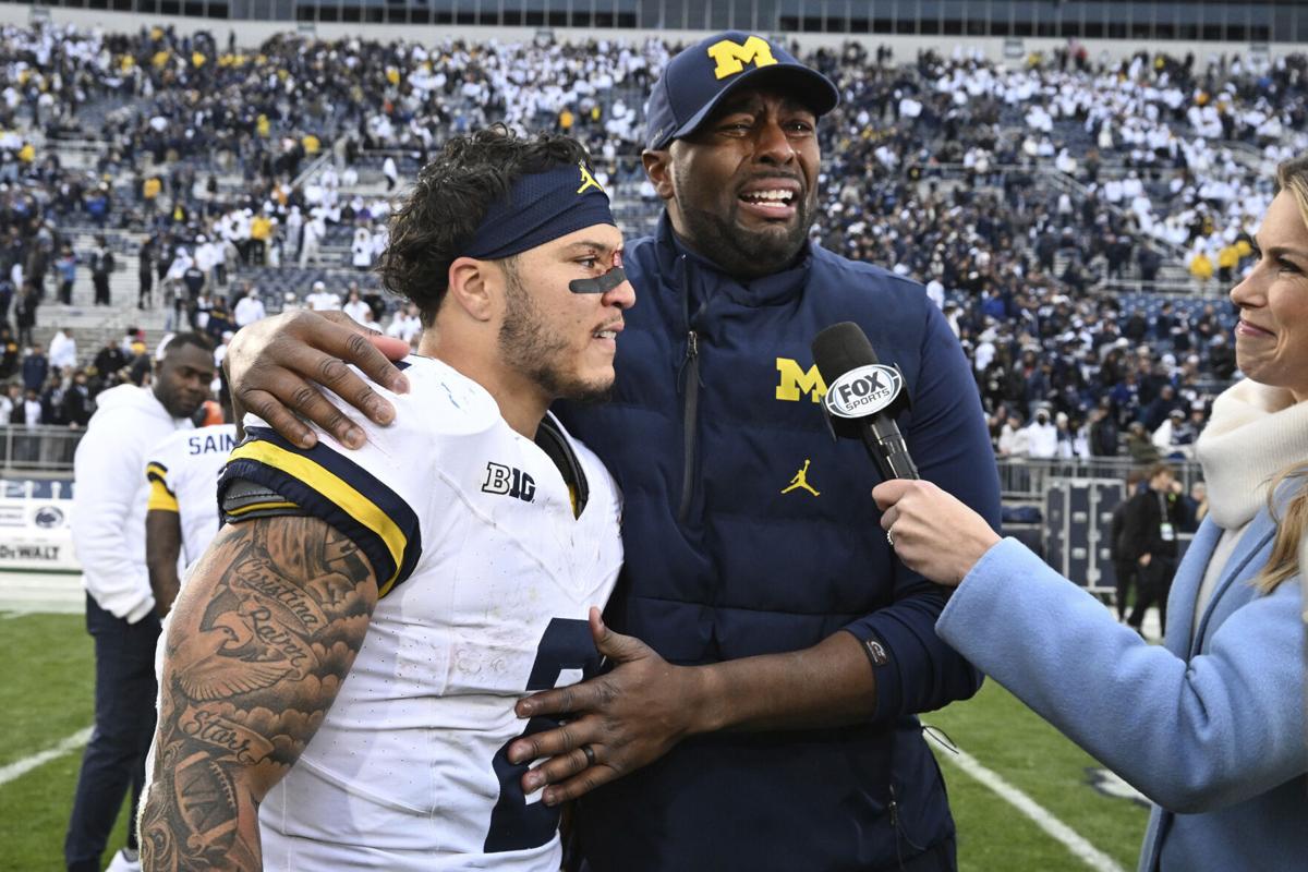 Harbaugh's suspension keeps Moore in charge of Michigan