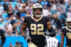 Sep 25, 2022; Charlotte, North Carolina, USA; New Orleans Saints defensive end Marcus Davenport (92) rush off the field against the Carolina Panthers during the second half at Bank of America Stadium. Mandatory Credit: James Guillory-USA TODAY Sports