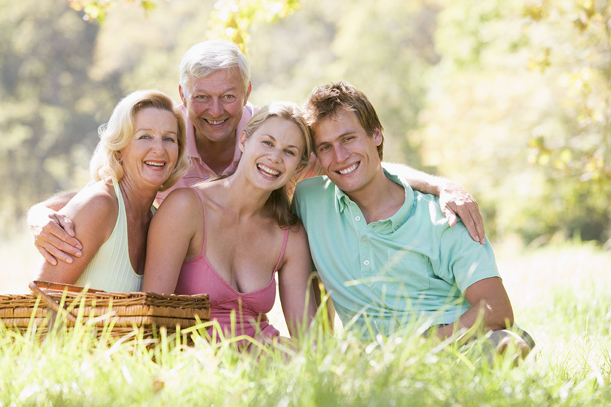 Parents with adult children on picnic