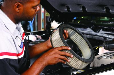 Mechanic checking air filter