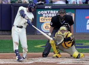 Milwaukee Brewers second baseman Brice Turang (2) hits an RBI double during the second inning of their game against the San Diego Padres Thursday, May 14, 2026 at American Family Field in Milwaukee, Wisconsin.