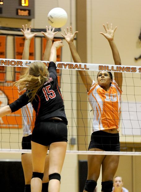 Taylor Mims jumps for a block
