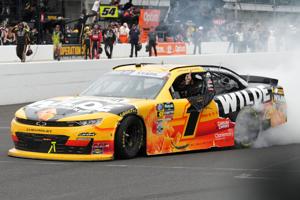 NASCAR O'Reilly Auto Parts Series driver Carson Kvapil (1) celebrates Saturday, July 25, 2026, following his win in the Pennzoil