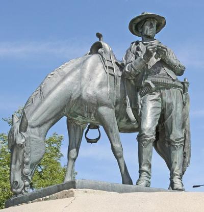 statue of cowboy and