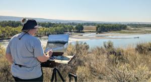 Artist on the river