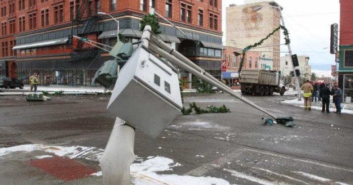 Dump truck knocks down power lines, poles after hitting Christmas garland