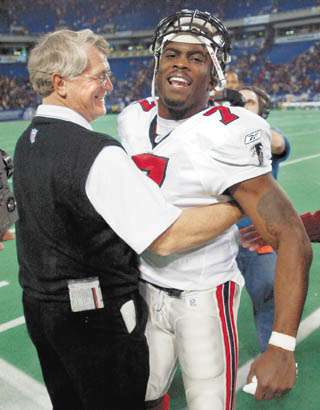 Quarterback Michael Vick of the Atlanta Falcons drops back to pass