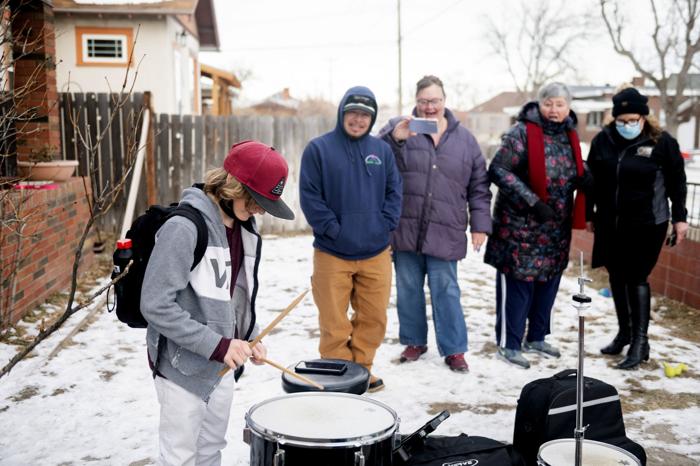 Newspaper photo leads man to donate drums to young musician