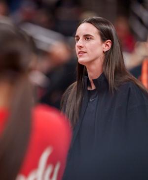 Indiana Fever guard Caitlin Clark (22) watches as her team mates warm up as the Portland Fire face the Indiana Fever Wednesday, May 20, 2026, at the Gainbridge Fieldhouse in Indianapolis.