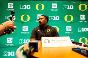 Oregon offensive lineman Iapani Laloulu talks with journalists during Oregon Football’s media day at Autzen Stadium in Eugene, Oregon on August 3, 2026.