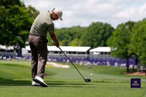 May 7, 2026; Charlotte, North Carolina, USA; Adam Scott hits his tee shot on hole eighteen during the first round of the Truist Championship golf tournament. Mandatory Credit: Jim Dedmon-Imagn Images