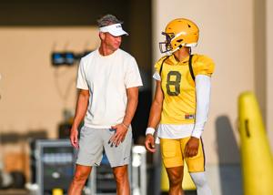 LSU Tigers head football coach Lane Kiffin talking with Quarterback Husan Longstreet 8 at LSU Football practice. August 18,