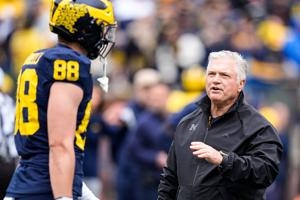 Michigan tighe ends coach Freddie Whittingham, right, talks to tight end Deakon Tonielli (88) before the spring game at Michigan Stadium in Ann Arbor on Saturday, April 18, 2026.
