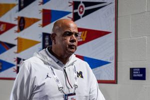 Michigan athletic director Warde Manuel walks towards Michigan locker room before open practice at Lucas Oil Stadium in Indianapolis on Friday, April 3, 2026.