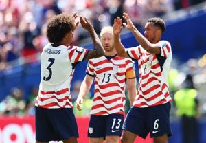 June 19, 2026; Seattle, Washington, U.S.; Chris Richards, Auston Trusty and Tim Ream of the U.S. celebrate after the match.  Mandatory Credit: Blake Dahlin-Imagn Images