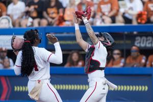 Jun 4, 2026; Oklahoma City, OK, USA; Texas Tech Red Raiders catcher Lagi Quiroga (4) catches a popup for an out near pitcher Nijaree Canady (24) in the first inning against the Texas Longhorns during Game Two of the NCAA WomenÕs College World Series 
