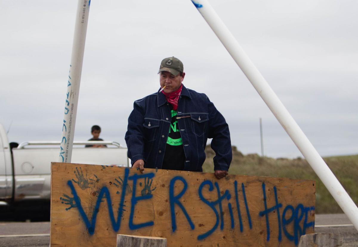 A protester carries a sign
