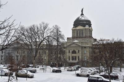 Snow falls on the Montana State Capitol