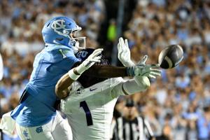 Sep 1, 2025; Chapel Hill, North Carolina, USA; TCU Horned Frogs safety Austin Jordan (1) breaks up a pass intended for North Carolina Tar Heels wide receiver Jordan Shipp (1) in the second quarter at Kenan Stadium. Mandatory Credit: Bob Donnan-Imagn 