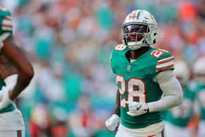 Dec 21, 2025; Miami Gardens, Florida, USA; Miami Dolphins running back De'Von Achane (28) reacts after scoring a touchdown during the first quarter against the Cincinnati Bengals at Hard Rock Stadium. Mandatory Credit: Sam Navarro-Imagn Images