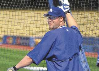 Pitcher Eric Gagne of the Los Angeles Dodgers can only watch from