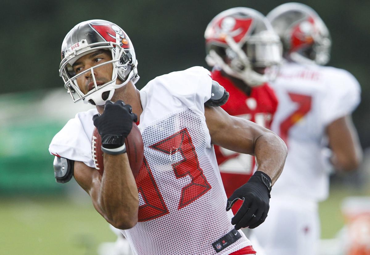 Tampa Bay Buccaneers wide receiver Vincent Jackson makes a catch during training camp practice at One Buccaneer Place in Tampa, Fla., on Tuesday, August 5, 2014.