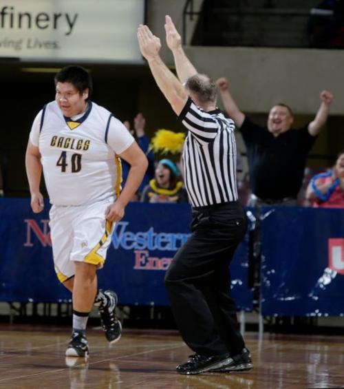 The Referee Signals A Three Point Shot Boys Basketball