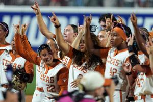 Texas Longhorns pitcher Teagan Kavan celebrates with teammates after Game 1 of the NCAA softball Women's College World Series finals between the Texas Longhorns and the Texas Tech Red Raiders at Devon Park in Oklahoma City, Wednesday, June 3, 2026.
