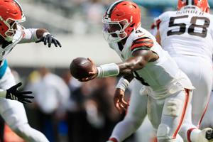 Cleveland Browns quarterback Deshaun Watson (4) hands off to wide receiver KC Concepcion Jr. (1) during the fourth quarter of an