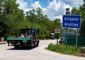 A Guaranteed Fence Corp truck turns into the entrance after Governor Ron DeSantis held a press conference at Alligator Alcatraz