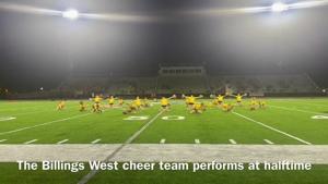 The Billings West cheer team performs at halftime of Golden Bears' Gold Rush game
